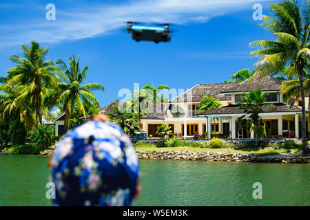 Man About to Launch Drone into the Air Stock Photo