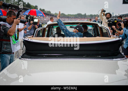 Hockenheim, Germany. 28th July, 2019. Mercedes AMG Petronas F1 Team's British driver Lewis Hamilton (C) attends the drivers parade prior to the start of the German F1 Grand Prix race. Credit: SOPA Images Limited/Alamy Live News