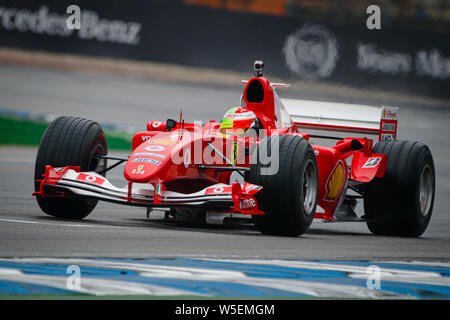 Hockenheim, Germany. 28th July, 2019. German F2 driver Mick Schumacher drives Ferrari F2004 of his father Michael Schumacher prior to the start of the German F1 Grand Prix. Credit: SOPA Images Limited/Alamy Live News Stock Photo