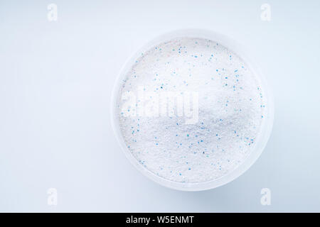 Blue plastic washing powder measuring cup isolated on white Stock Photo -  Alamy