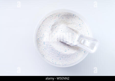 Blue plastic washing powder measuring cup isolated on white Stock Photo -  Alamy