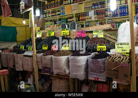 Market stall with labelled sacks of local products for sale in La Merced (Mercado De La Merced) in Mexico City, CDMX, Mexico. Jun 2019 Stock Photo