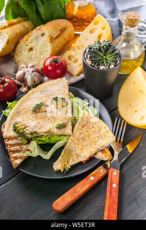 Frittata. Omelette with vegetables and cheese on toast with ice salad. Tasty breakfast. Stock Photo