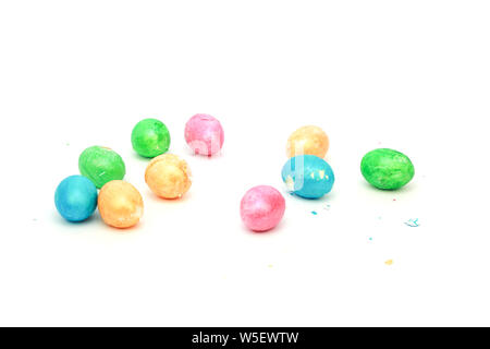 Multicolored broken Easter eggs on a white background concept of the end of the Easter holiday and the Great Lent, isolate, religion, decoration Stock Photo