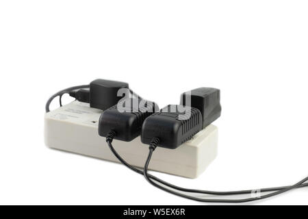 Multiple socket with connected power Strip with a bunch of plugs and adapter on white background Stock Photo