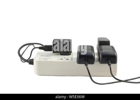 Multiple socket with connected power Strip with a bunch of plugs and adapter on white background Stock Photo
