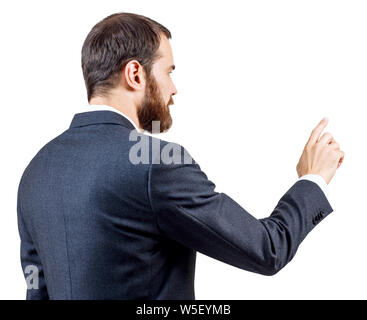 Businessman with beard pointing to something or touching by forefinger. Stock Photo