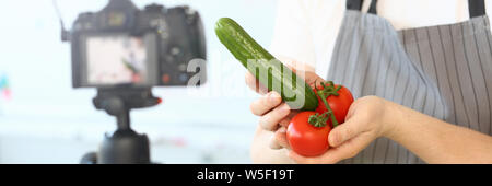 Comic Culinary Blogger Holding Organic Vegetables Stock Photo