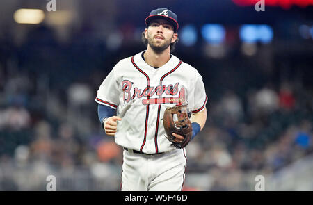 The Braves' Dansby Swanson high fives teammates prior to a game against the  Arizona Diamondbacks on Monday, Aug…