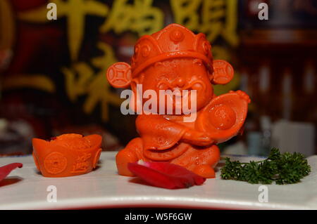 A piquant chafing dish seasoning featuring shape of pig is displayed during the 100th China Food and Drinks Fair in Chengdu city, southwest China's Si Stock Photo