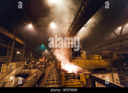 steel production in electric furnaces. Huge ironworks. Stock Photo