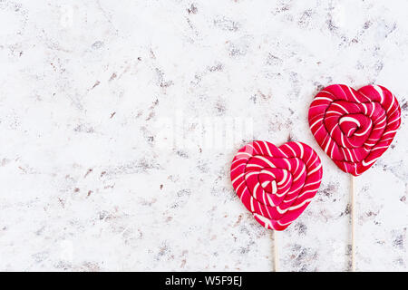 Colorful lollipops on white background. Top view Stock Photo