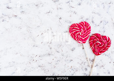 Colorful lollipops on white background. Top view Stock Photo