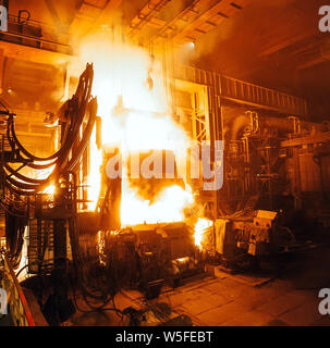 Steel production in electric furnaces. Huge ironworks. Stock Photo