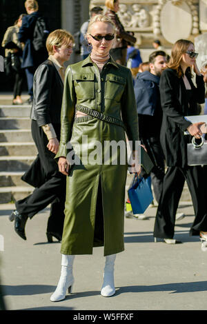 A pedestrian poses for a street style snap during the Paris Fashion Week Fall/Winter 2019 in Paris, France, 27 February 2019. Stock Photo