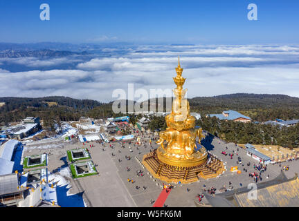 Landscape of the golden Buddha statue on the Golden Summit of Mount Emei, or Emei Mountain, in Emeishan city, southwest China's Sichuan province, 3 Ma Stock Photo