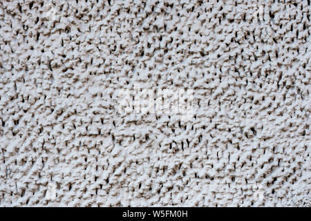 Decorative exterior wall plaster with embossed surface - image Stock Photo