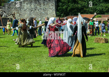 City Cesis, Latvian Republic. At a medieval dance city festival, people dance in medieval clothes. July 20 2019. Stock Photo