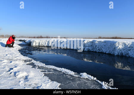 A snowy landscape of the scenic area of Zhadun River covered with snow in Yakeshi city, Hulunbuir city, north China's Inner Mongolia Autonomous Region Stock Photo