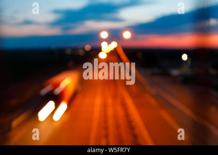 Traffic on freeway at twilight. Defocused shot Stock Photo