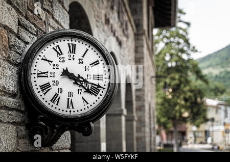 Old retro wall clock at a train station Stock Photo