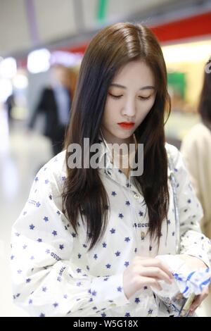 Chinese actress and singer Ju Jingyi arrives at an airport in Shanghai, China, 18 March 2019. Stock Photo