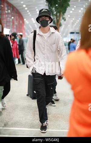 Chinese actor Liu Haoran arrives at the Beijing Capital International ...