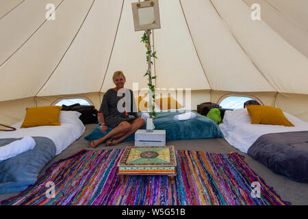 Large high end glamping tents, at an outdoor festival UK Stock Photo