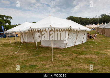 Large high end glamping tents, at an outdoor festival UK Stock Photo