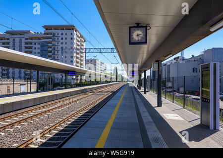 Train station, new railway empty platform, urban infrastructure in city of Warsaw in Poland. Stock Photo