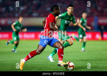 Cameroonian football player Christian Bassogog, of Henan Jianye dribbles against Beijing Sinobo Guoan in their 20th round match during the 2019 Chinese Football Association Super League (CSL) in Zhengzhou city, central China's Henan province, 27 July 2019. Henan Jianye defeated Beijing Sinobo Guoan 1-0.