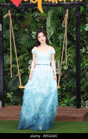 Chinese singer and network anchor Feng Timo poses as she arrives for the 26th Chinese Top Ten Music Awards 2019 in Shanghai, China, 25 March 2019. Stock Photo