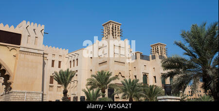 traditional Arab wind tower for air conditioning and cooling on top of building in Dubai, United Arab Emirates Stock Photo