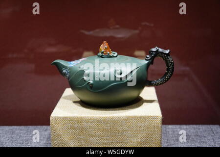 Purple clay teapot works are on display at the 'Capitals Lingering Charm, Yishun Ji's Purple Sand Exhibition' in Beijing, China, 28 March 2019.   The Stock Photo