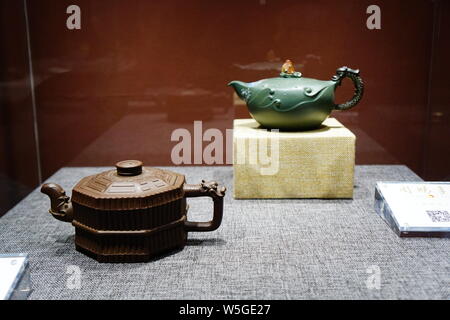 Purple clay teapot works are on display at the 'Capitals Lingering Charm, Yishun Ji's Purple Sand Exhibition' in Beijing, China, 28 March 2019.   The Stock Photo