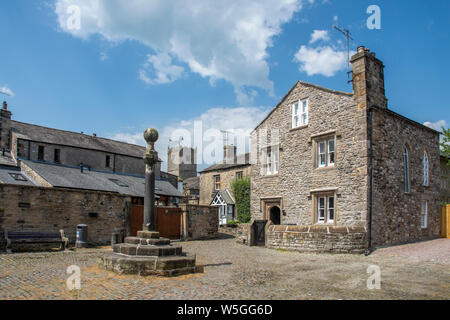 The old Swine Market in the past coal and pigs were sold by the stone cross  area of Kirkby Lonsdale  a small town and civil parish in the South Lakel Stock Photo