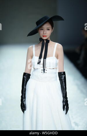 A model displays a new creation by Chinese designer Tanya Wang Yannan ...