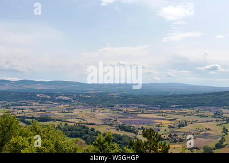 Vaucluse mountains : Background with aerial view on lavender fields surrounding the hilltop villages of Sault, Ferrassieres and Aurel Stock Photo