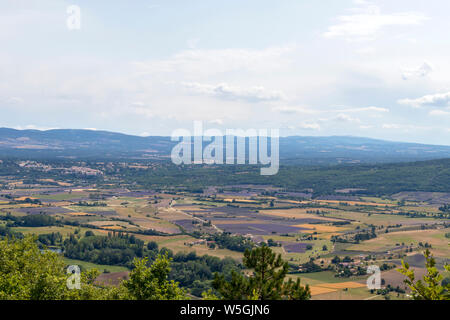 Vaucluse mountains : Background with aerial view on lavender fields surrounding the hilltop villages of Sault, Ferrassieres and Aurel Stock Photo