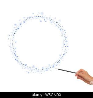 Christmas magic wand in hand with blue snowflakes, circles for frame, border. White background. Stock Photo