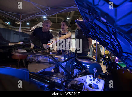 https://l450v.alamy.com/450v/w5gr1t/190729-houston-july-29-2019-xinhua-people-view-customized-light-display-of-an-engine-at-the-omni12-car-show-in-houston-texas-the-united-states-on-july-28-2019-the-inaugural-omni12-car-show-provided-a-platform-for-showing-and-trading-automotive-aftermarket-products-including-tires-body-parts-electronics-painting-and-more-photo-by-yi-chin-leexinhua-w5gr1t.jpg