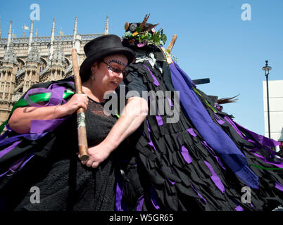 Parliament. Morris dancers protest at May 4th 2020 being designated VE day celebration instead of being the May Day holiday. Black Swan border morris Stock Photo