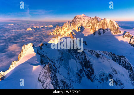 Aerial view of snowy peaks of Mont Blanc and Dent du Geant during sunrise, Courmayeur, Aosta Valley, Italy, Europe Stock Photo