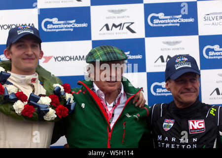 Sir Jackie Stewart posing with the winners of the FIA Masters Historic Formula One race, after  he presented  the trophies. Stock Photo