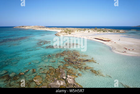 Aerial bird's-eye view from drone on Elafonisi sandy beach on Crete. Elafonissi is one of the most known world beaches and is famous for pink sand. Ki Stock Photo