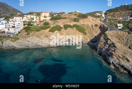 Aerial view of resort village Bali and small two cave beach. Crete, Greece. Stock Photo