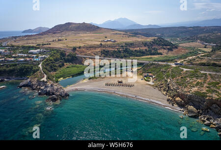 Aerial view from drone on Geropotamos beach and road bridge over river on Crete, Greece, Rethymno prefecture. Stock Photo