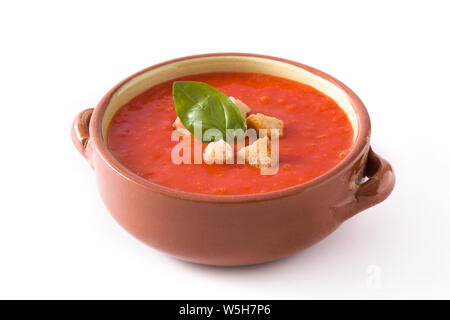 Tomato soup in brown bowl isolated on white background Stock Photo
