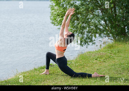 Comfortable stretch in low lung pose Stock Photo