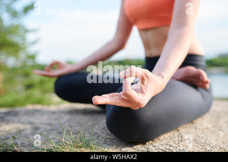 Keeping hands in mudra during meditation Stock Photo